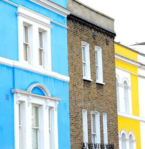 notting hill london bright blue and yellow buildings