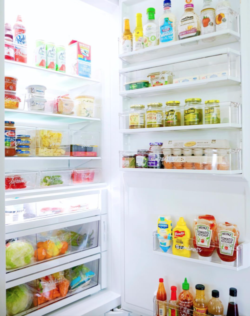 organized fridge with acrylic containers the home edit