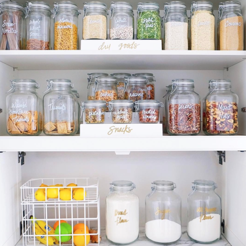 organized pantry with labeled jars the home edit