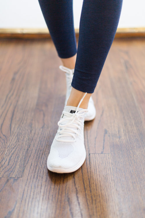 outdoor voices 7:8 warmup legging in navy and nike free run flyknit 2 sneakers in white