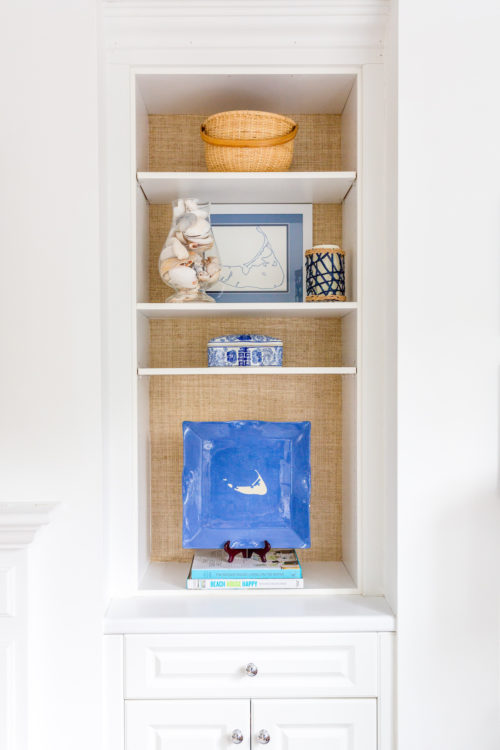 grasscloth wallpaper in bookshelves on design darling