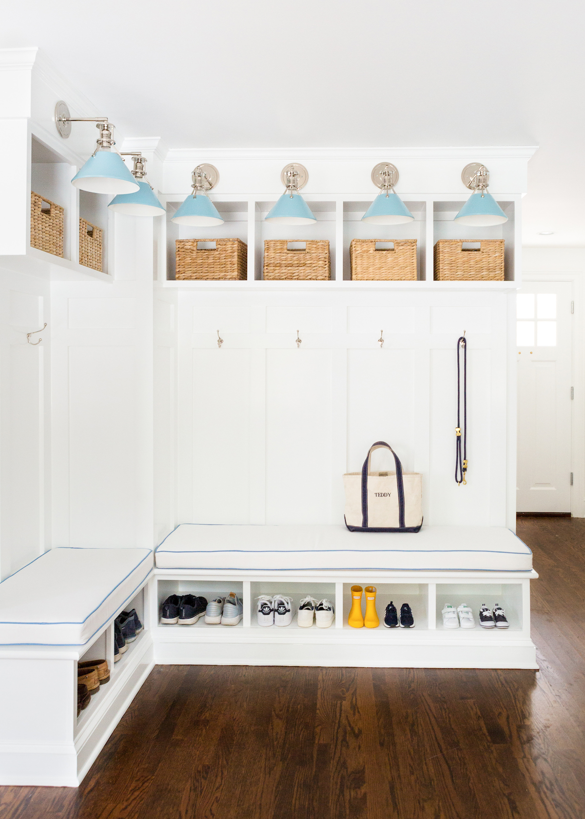 design darling mudroom built-ins with hudson valley lighting mark d. sikes painted no. 2 sconces in bluebird:polished nickel