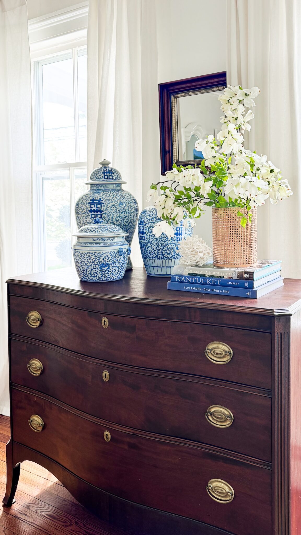 mahogany dresser with blue and white ginger jars